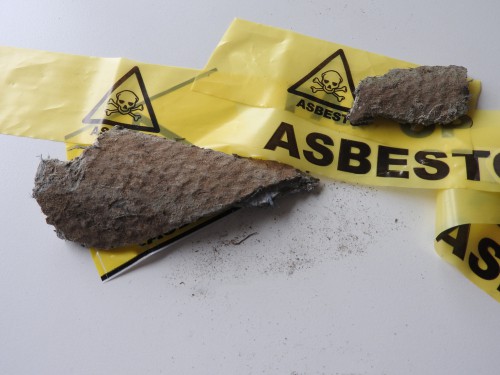 Close,Up,Of,Pieces,Grey,Asbestos,And,Fibers.,Roof,Tiles